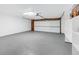 Spacious garage with overhead lighting and built-in shelving at 520 Columbine St, Denver, CO 80206