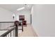 Bright hallway featuring modern railings, natural light, and access to multiple rooms at 520 Columbine St, Denver, CO 80206