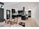 Modern kitchen featuring black cabinetry, stainless steel appliances, and a stylish central island at 520 Columbine St, Denver, CO 80206