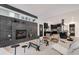 Open living space with modern fireplace, and view into kitchen area at 520 Columbine St, Denver, CO 80206