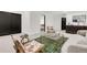 Open-concept living room featuring a sofa, patterned chairs and a view to the main bedroom at 520 Columbine St, Denver, CO 80206