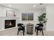 Cozy living room featuring a modern fireplace, game table and two modern chairs at 520 Columbine St, Denver, CO 80206