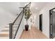 Elegant staircase with a metal railing and light wood steps at 520 Columbine St, Denver, CO 80206