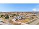 Expansive aerial view of a luxury home nestled in a beautiful neighborhood with mountain views at 8680 Summerlin Pl, Longmont, CO 80503