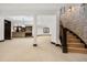 Finished basement showcases a staircase, bar area, and ample open space, perfect for entertaining at 8680 Summerlin Pl, Longmont, CO 80503