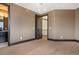 Bedroom featuring hardwood floors and a view into the adjacent bathroom at 8680 Summerlin Pl, Longmont, CO 80503