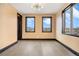 Bright bedroom features hardwood floors, complemented by black trim on windows and baseboards at 8680 Summerlin Pl, Longmont, CO 80503