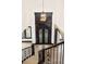 Elegant foyer features a decorative wrought iron double door and chandelier, with hardwood floors at 8680 Summerlin Pl, Longmont, CO 80503