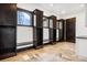 Well-organized mudroom with built-in storage, bench seating, and tile flooring at 8680 Summerlin Pl, Longmont, CO 80503