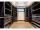 Large walk-in closet offers custom shelving and ample storage space at 8680 Summerlin Pl, Longmont, CO 80503