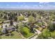 Aerial view of neighborhood showcasing manicured lawns and mature trees and mountain views at 6150 S Southwood Dr, Centennial, CO 80121