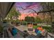 Enjoy outdoor living on this spacious deck with comfortable seating and scenic views at sunset at 6150 S Southwood Dr, Centennial, CO 80121