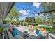 Large deck with comfortable seating and outdoor dining area, offering a serene space to enjoy the outdoors at 6150 S Southwood Dr, Centennial, CO 80121