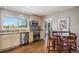 Bright kitchen with stainless steel appliances, granite countertops, and a cozy breakfast nook with seating at 6150 S Southwood Dr, Centennial, CO 80121