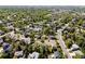 A stunning aerial perspective of a sprawling neighborhood with mature trees and winding roads at 19817 E Prentice Ave, Centennial, CO 80015