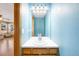 Cozy half bathroom featuring blue walls and wooden vanity at 19817 E Prentice Ave, Centennial, CO 80015