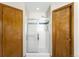 Tiled shower with glass doors between two entry doors at 19817 E Prentice Ave, Centennial, CO 80015