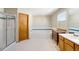 Bright bathroom showcasing a tiled shower and relaxing tub at 19817 E Prentice Ave, Centennial, CO 80015
