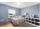 Bright bedroom with a leafy view and storage cubbies at 19817 E Prentice Ave, Centennial, CO 80015