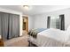 Bedroom with a light-colored carpet, white walls, and natural light at 19817 E Prentice Ave, Centennial, CO 80015