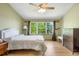 Bright bedroom with large window and leafy view at 19817 E Prentice Ave, Centennial, CO 80015