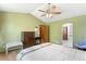 Comfortable bedroom featuring a vaulted ceiling and adjoining bath at 19817 E Prentice Ave, Centennial, CO 80015