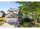 Charming two-story home featuring a stone facade and well-manicured lawn in a suburban setting at 19817 E Prentice Ave, Centennial, CO 80015