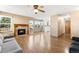 Cozy living room showcasing a fireplace, wood flooring, and access to the backyard at 19817 E Prentice Ave, Centennial, CO 80015