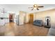 Spacious living room featuring hardwood floors and open layout to the kitchen and dining areas at 19817 E Prentice Ave, Centennial, CO 80015