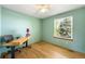 Bright home office with wooden floors and a large window at 19817 E Prentice Ave, Centennial, CO 80015