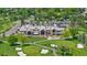 An aerial shot captures a golf course, showcasing its well-manicured lawns, clubhouse, and scenic surroundings at 41 Eagle Dr, Littleton, CO 80123