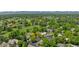 An aerial view highlighting the area's lush landscapes, homes, and tree coverage at 41 Eagle Dr, Littleton, CO 80123