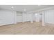 Unfinished basement offers ample storage with wood floors, closet and shelving spaces at 41 Eagle Dr, Littleton, CO 80123