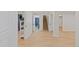Finished basement showcasing wood floors and white trim and paint with an open doorway at 41 Eagle Dr, Littleton, CO 80123