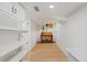 Spacious basement featuring durable flooring, built-in shelves, and a convenient workbench area at 41 Eagle Dr, Littleton, CO 80123
