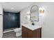 Modern bathroom with a tiled walk-in shower, sleek vanity, and a modern faucet at 41 Eagle Dr, Littleton, CO 80123