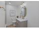 Well-lit bathroom featuring gray cabinets, stone countertop and elegant finishes at 41 Eagle Dr, Littleton, CO 80123