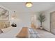 Bright bedroom with hardwood floors, ensuite bath, and large glass slider to backyard at 41 Eagle Dr, Littleton, CO 80123