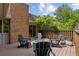 Outdoor deck with elegant seating with chairs around a fire pit, perfect for relaxation and entertaining at 41 Eagle Dr, Littleton, CO 80123