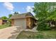 Charming home featuring an attached garage and a beautifully landscaped front yard at 41 Eagle Dr, Littleton, CO 80123