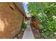 Beautiful brick home with a walkway leading to the front entrance, framed by lush greenery and vibrant flowers at 41 Eagle Dr, Littleton, CO 80123