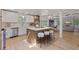 Bright, open kitchen features a large island with seating, stainless steel appliances, and sleek countertops at 41 Eagle Dr, Littleton, CO 80123