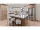Spacious kitchen with a large island, ample cabinet space, and stainless steel appliances, perfect for entertaining at 41 Eagle Dr, Littleton, CO 80123