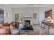 Bright living room with vaulted ceilings, white beams, fireplace and outdoor deck access at 41 Eagle Dr, Littleton, CO 80123