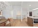 Bright open-concept living area with wood floors, a cozy staircase, and lots of space to move around at 41 Eagle Dr, Littleton, CO 80123