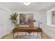 Bright office with large desk, woven chair, and decorative accents at 41 Eagle Dr, Littleton, CO 80123