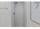 Close-up of newly remodeled shower with white subway tile at 41 Eagle Dr, Littleton, CO 80123