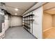 Basement storage area with newly installed shelves and space for storing equipment and belongings at 1945 Yosemite St, Denver, CO 80220
