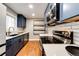 Stylish kitchen featuring stainless steel appliances, white subway tile backsplash, and modern fixtures at 1945 Yosemite St, Denver, CO 80220