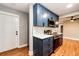 Contemporary kitchen with stainless steel appliances, dark blue cabinets, and an open layout at 1945 Yosemite St, Denver, CO 80220
